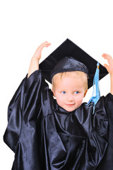 Cute little boy in graduation gown