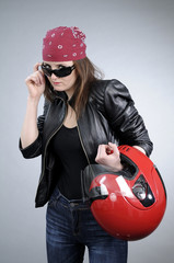 cool girl posing with sunglasses and red helmet