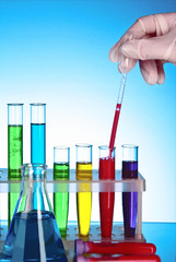 Test tubes over blue background