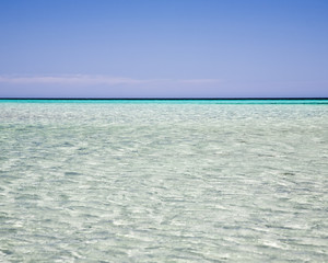 Fototapeta na wymiar Ripples in a clear blue sea at Dunsborough Western Australia