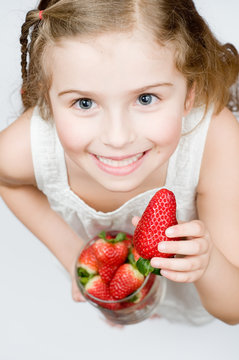 Little Girl Eating Strawberries