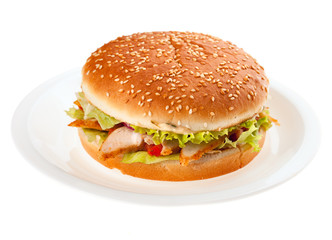 hamburger with vegetables on white plate