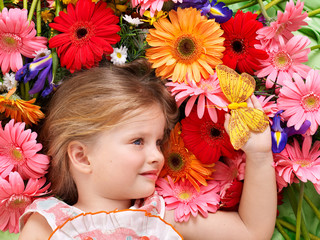 Cute child lying on the flower.
