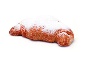 Fresh croissant with powdered sugar