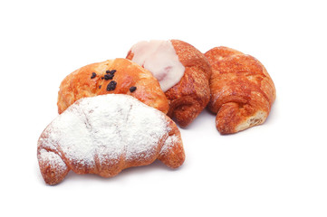 Different types of croissants isolated on white