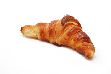 Single fresh croissant, casting soft shadow isolated on white