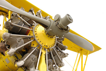 Vintage airplane engine in yellow