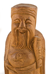 Fototapeta na wymiar Wooden statue of a chinese wise man closeup