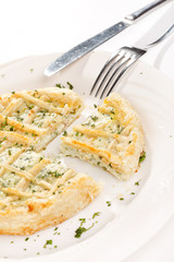 tasty quiche with cheese and herbs