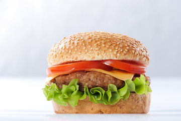 Cheeseburger with tomatoes and lettuce