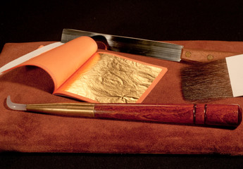a booklet of pure gold leaf for gilding with craftsman's tools