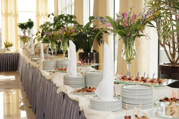 Table with dishware and tasty food