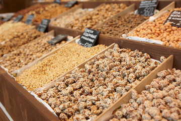 Variety of nuts on street market, limited focus