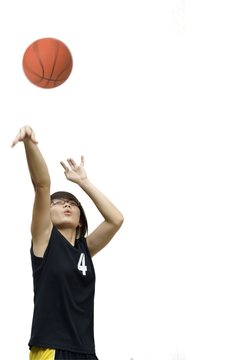 Asian Chinese Teen Girl Throw Basketball On White