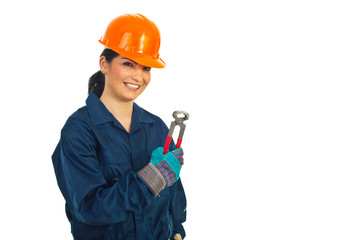 Happy worker woman holding pincers