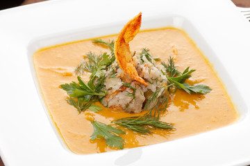 cream soup with rice and potato chips