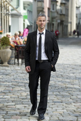 Businessman to walk on the street