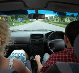 Young man and woman inside of a car