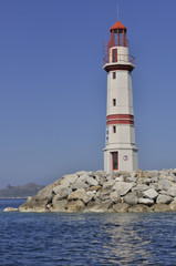 Fototapeta na wymiar light house at the Mediterranean sea