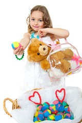 cute little girl with easter eggs and toys