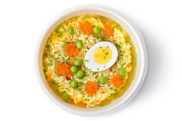 Cup of instant noodles with vegetables. Top view.