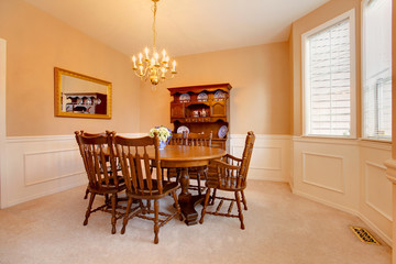 Classy creamy dining room with antique furniture