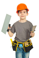 Boy holding notched and spatula