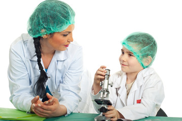 Teacher talking with student in laboratory