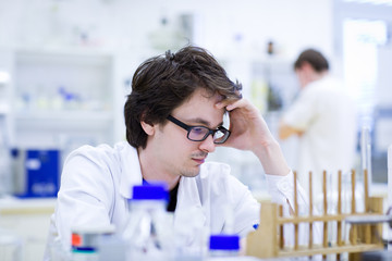 young male researcher carrying out scientific research