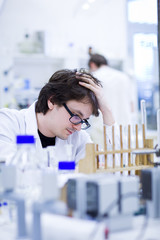 young male researcher carrying out scientific research