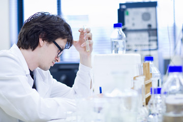 young male researcher carrying out scientific research