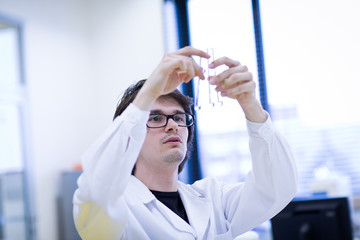 young male researcher carrying out scientific research