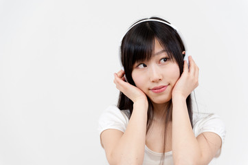 beautiful asian woman listening music