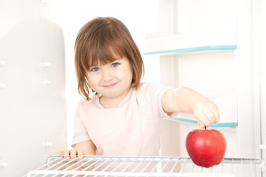 Girl Reaching For Apple