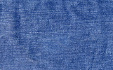 Closeup of worn denim fabric (as a background)