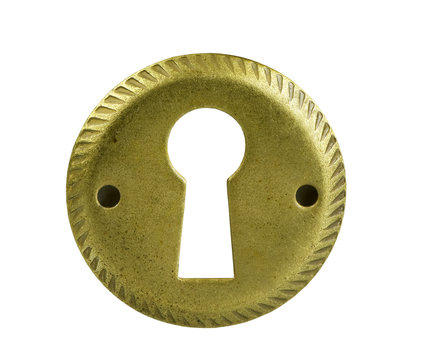 brass ornate keyhole on a white background