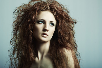 Naklejka premium Fashion portrait of a young beautiful redheaded woman