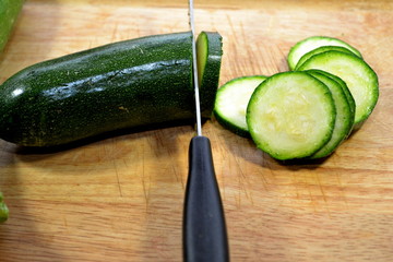 Slicing Zucchini on an Old Warn Cutting Board