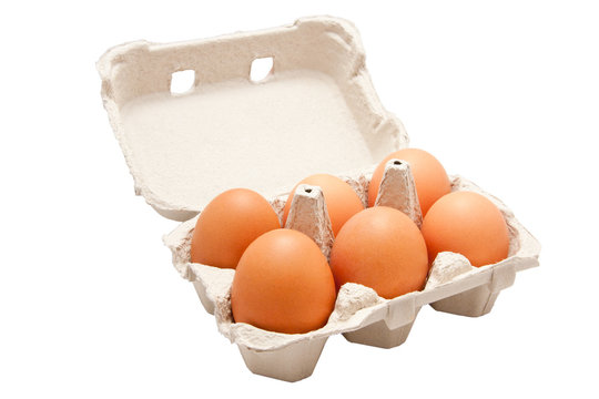 Six eggs in a recicled paper box on white background