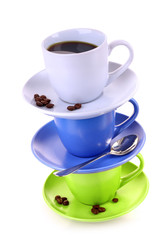 Color cups with coffee, and spoon on   white background