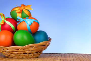 Easter eggs with  bows isolated on white