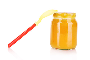 food for children and spoon on white background