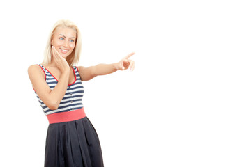 Attractive and surprised woman pointing her finger isolated