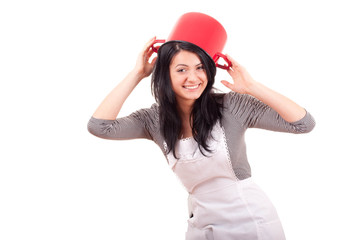 Attractivecook smiling and having a bowl on ger head isolated