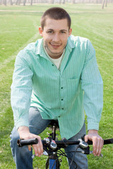 young man on bike outdoors