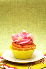 Vanilla cupcake with strawberry icing