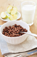 Chocolate cereal balls and milk