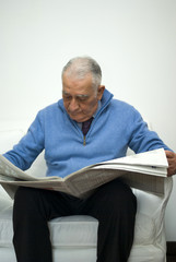 Senior man reading the newspaper