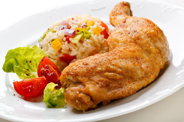 Roasted chicken leg, rice and vegetables