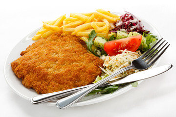 Pork chop, French fries and vegetables